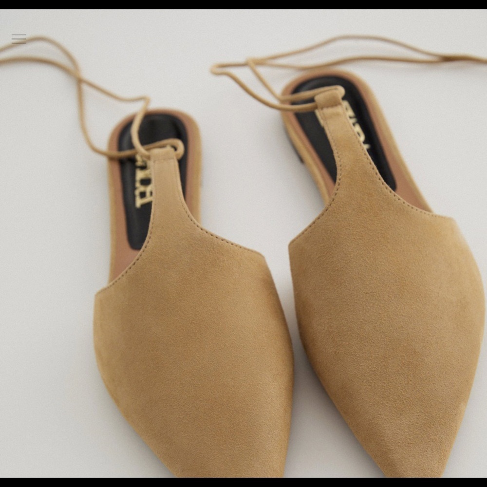 Camel suede flat mules.